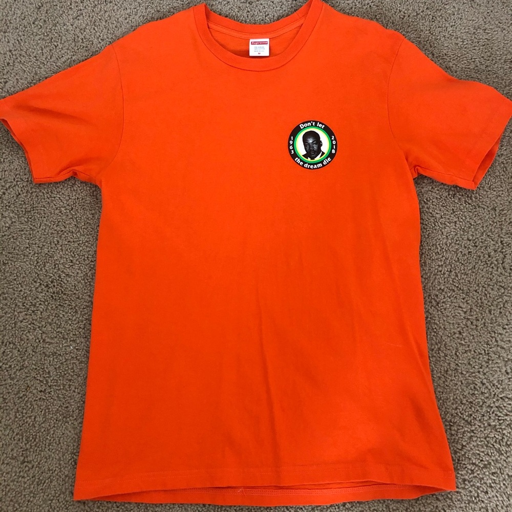 MLK has a dream orange supreme shirt